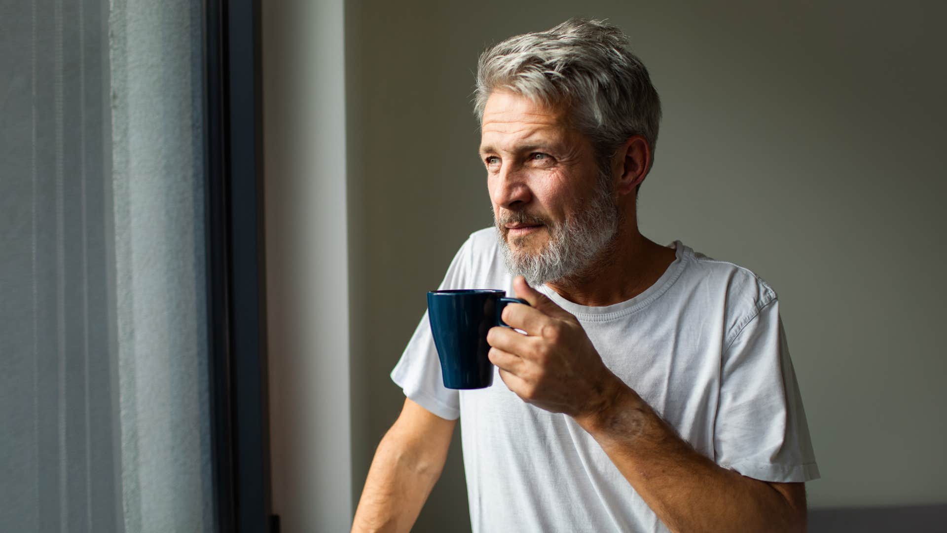 retired older man drinking coffee keeping his routine