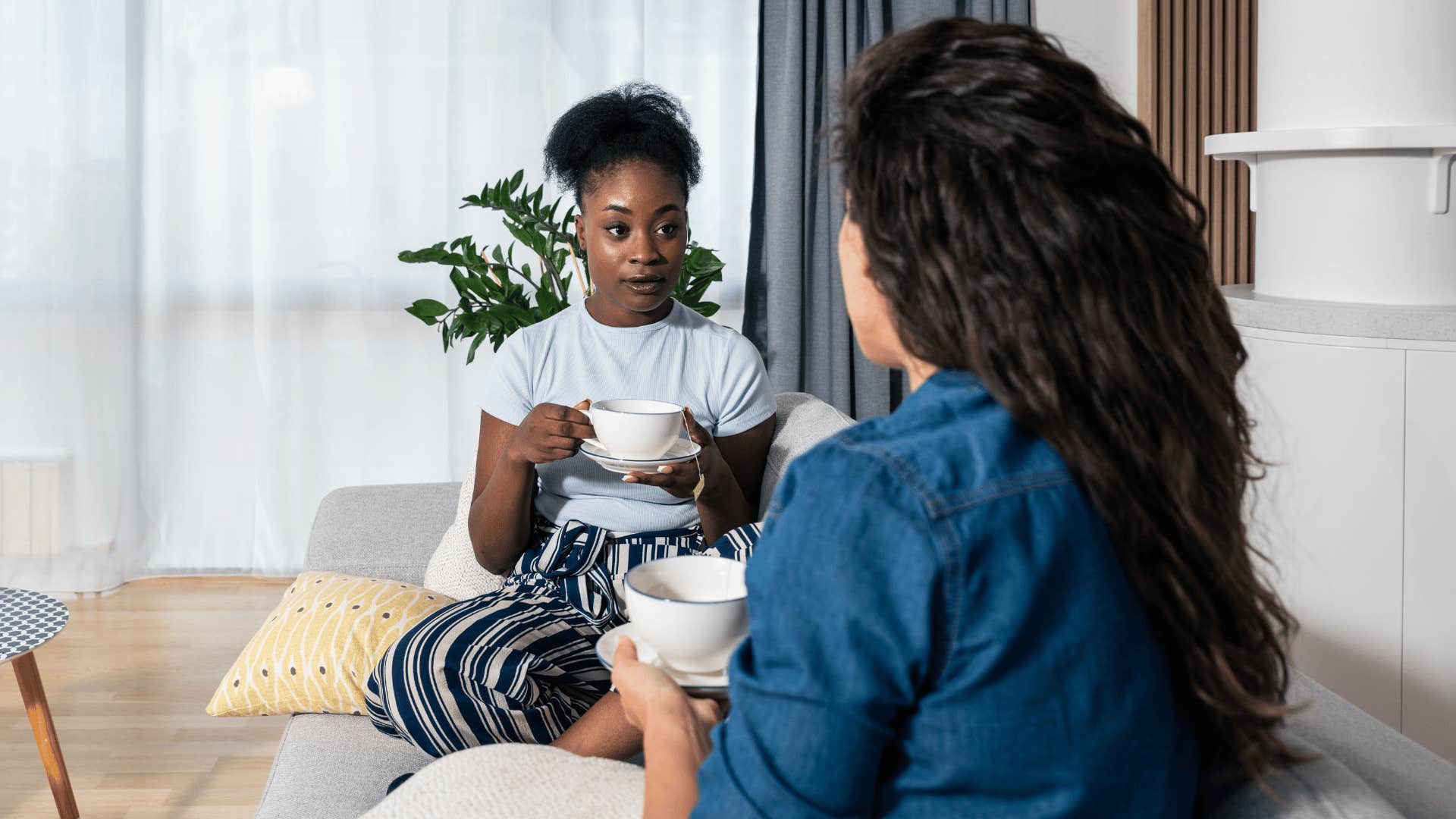 jealous woman discouraging friend from following her goals