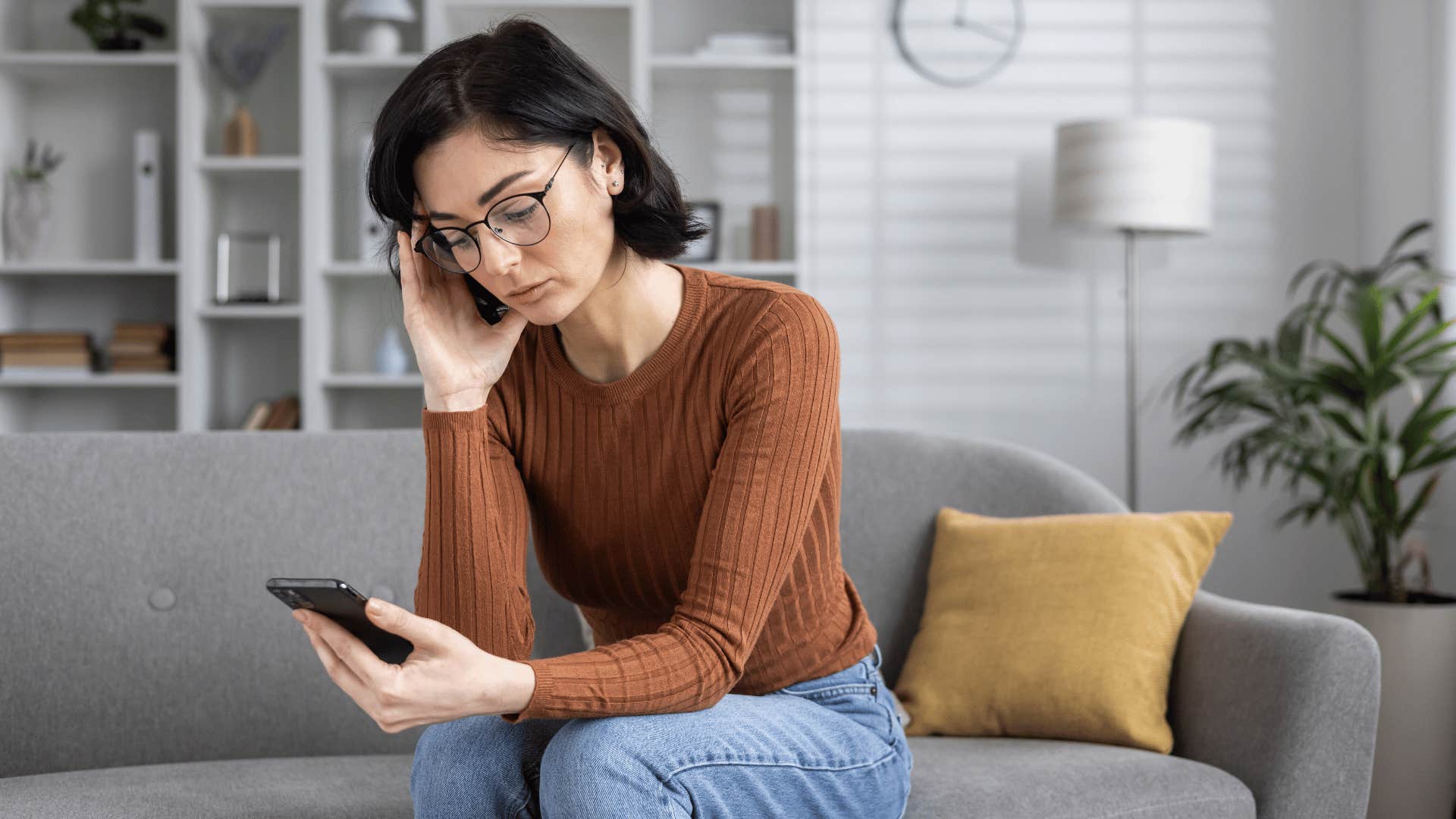 woman reading a text from a bad friend encouraging her to settle for less