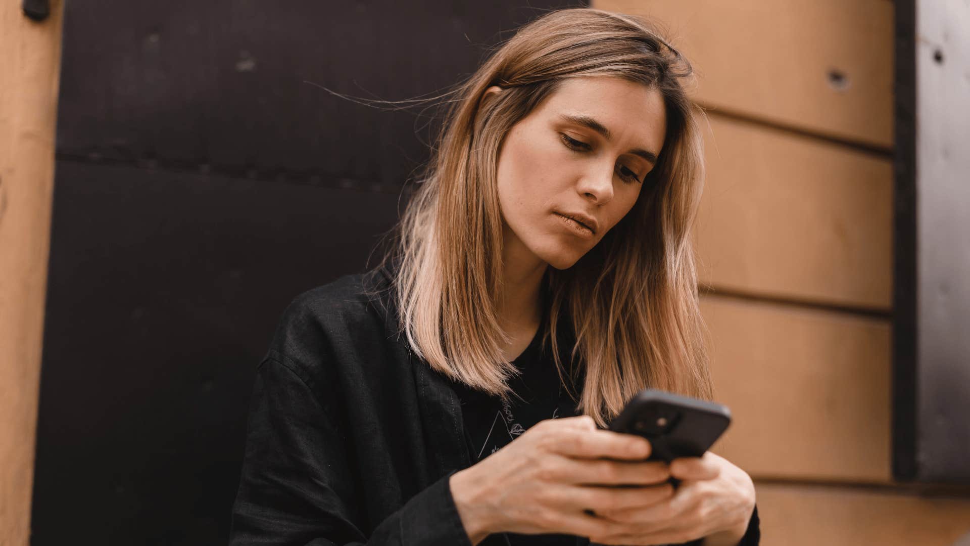 woman receiving a phone call from a friend who only shows up when she's sad