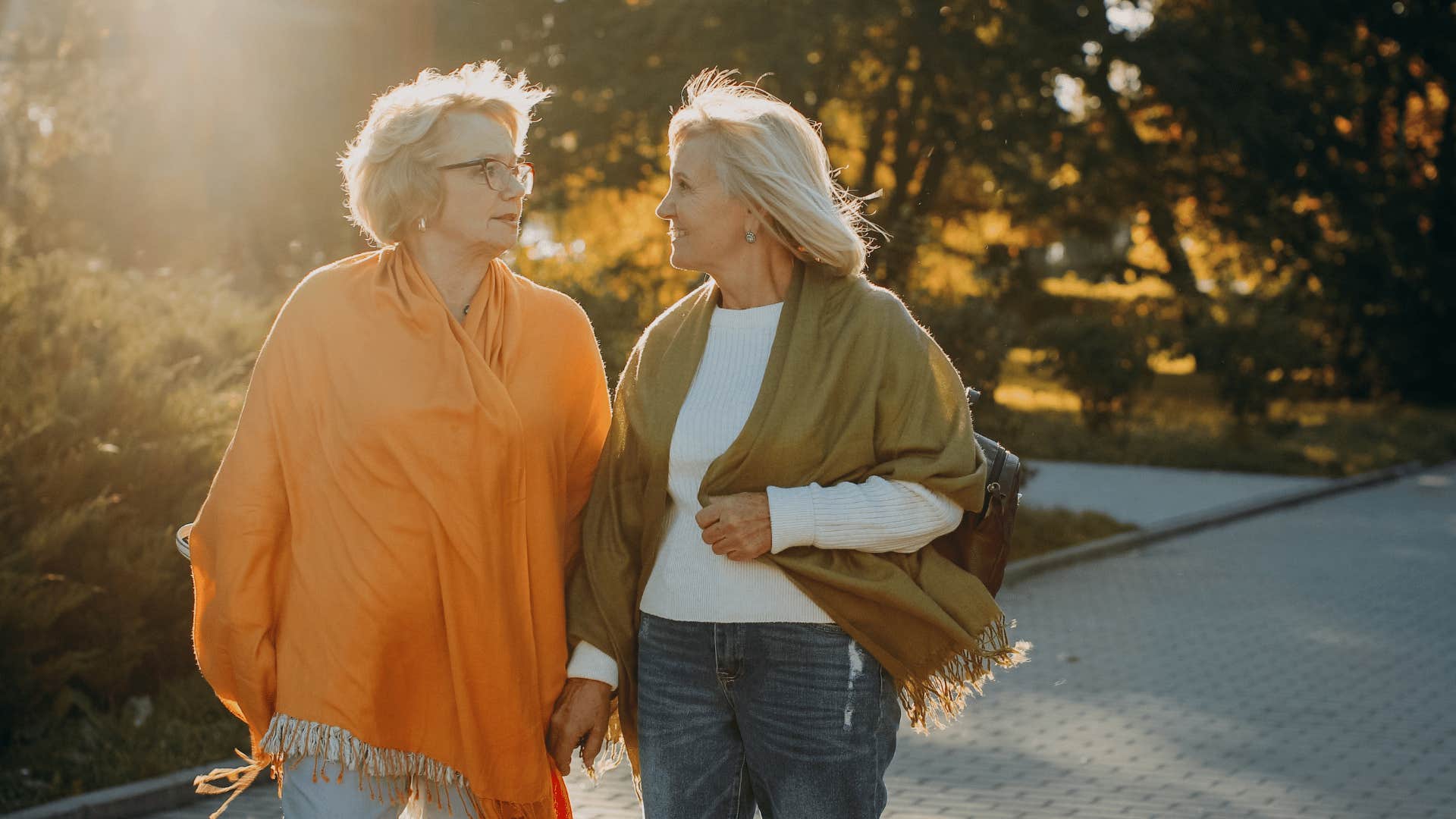 older friends walking turning their conversation into a competition