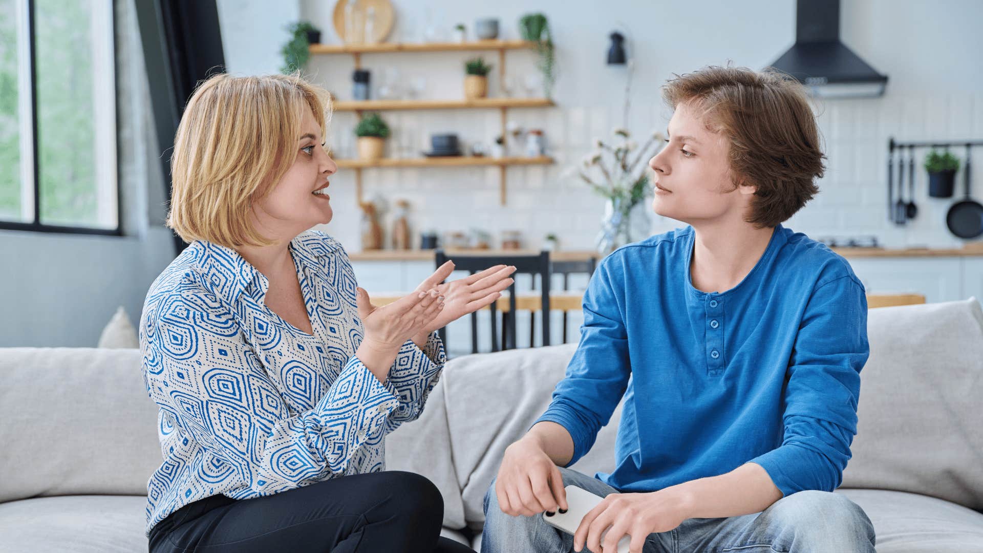 mom arguing with son competing with him