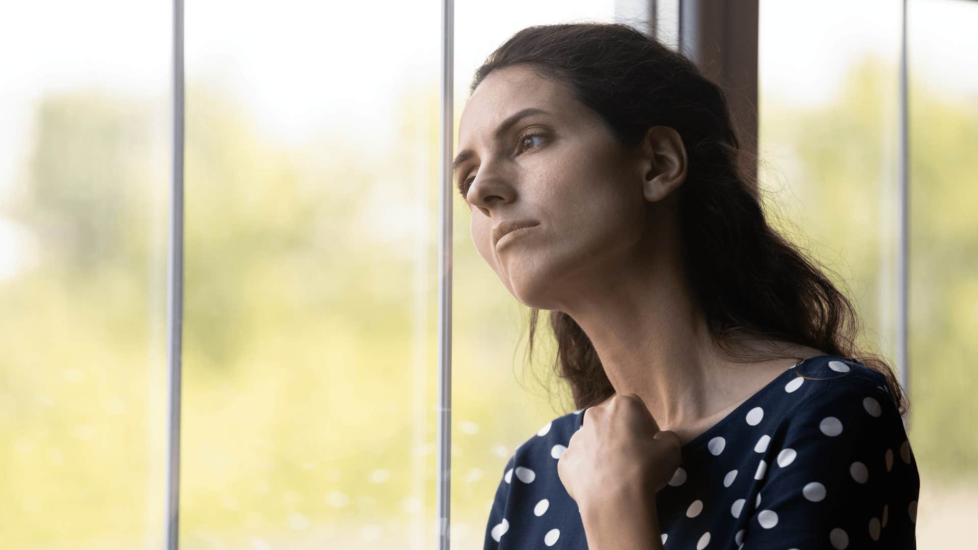grown woman feeling guilty due to a toxic mom