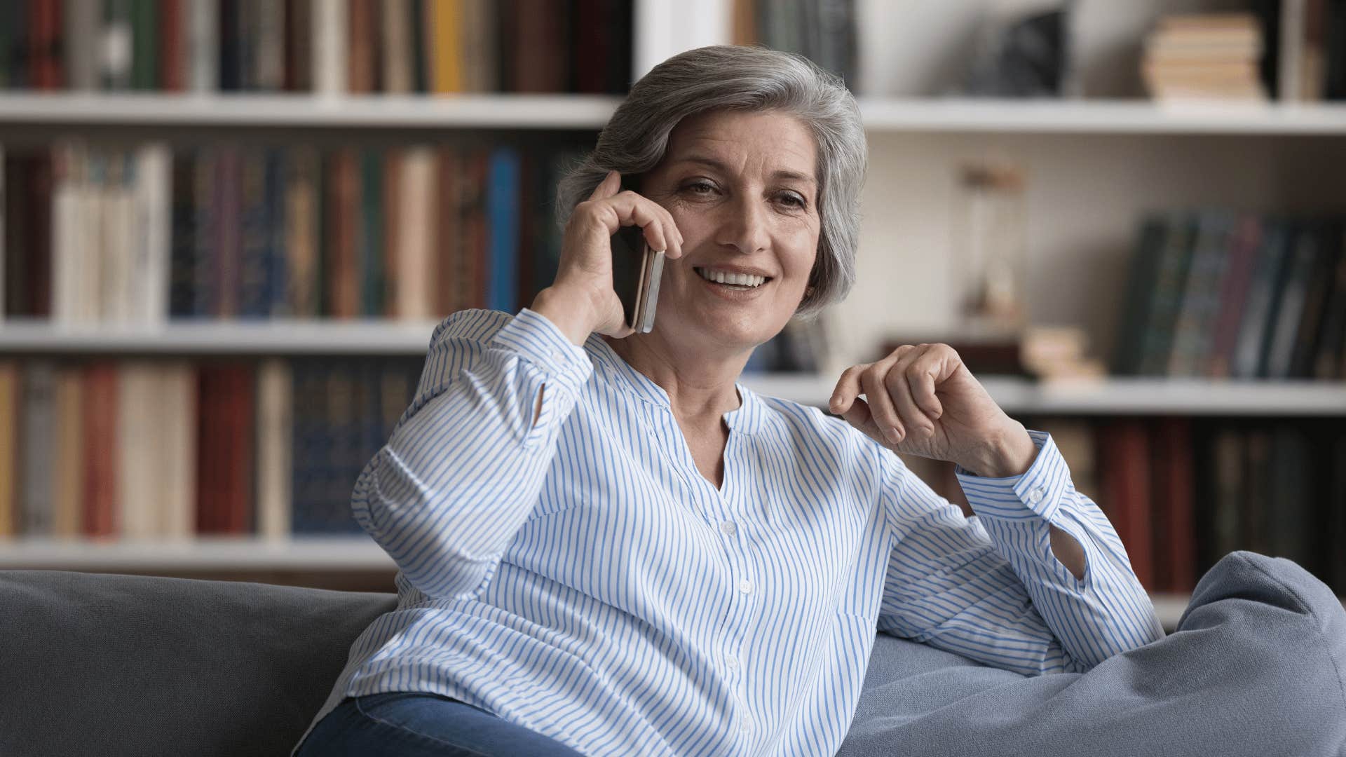 toxic woman sharing her children's failures with friends on the phone