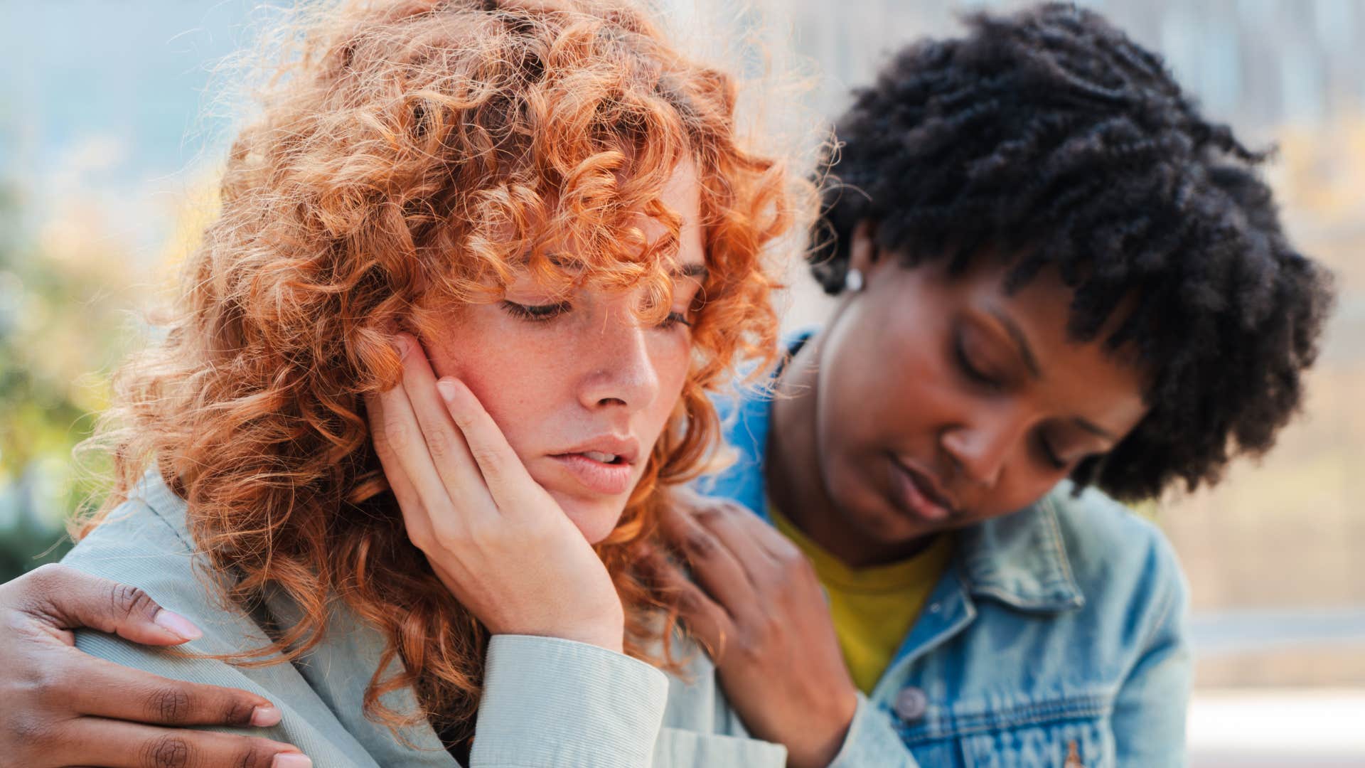 woman comforting friend with traumatic intelligence feelings things incredibly deeply