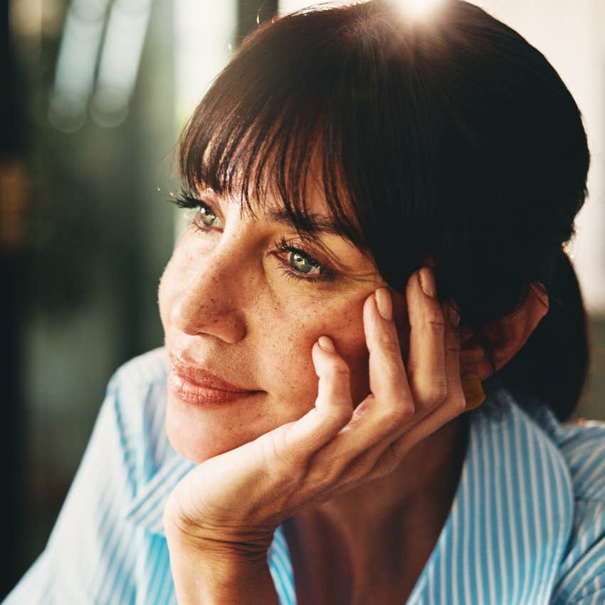 woman daydreaming about a soul connection who's always on her mind
