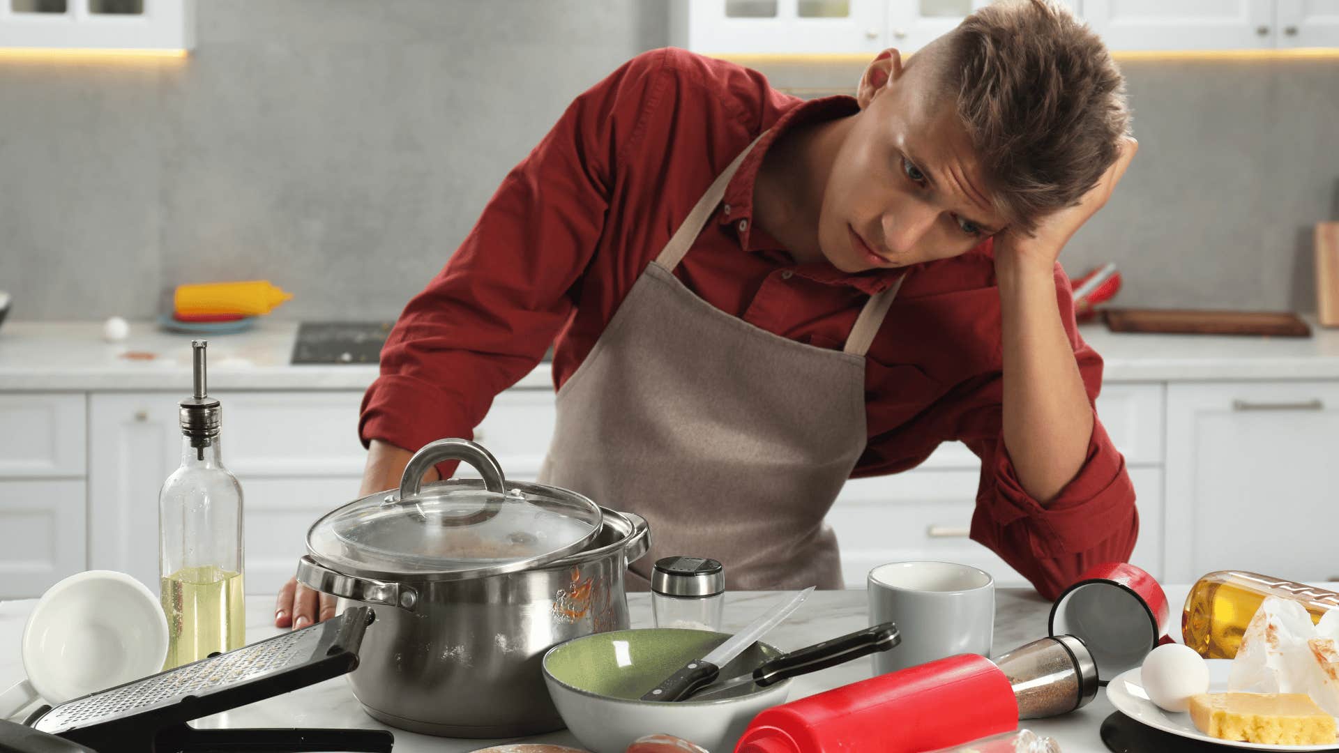 man looking at dirty dishes making simple tasks more difficult