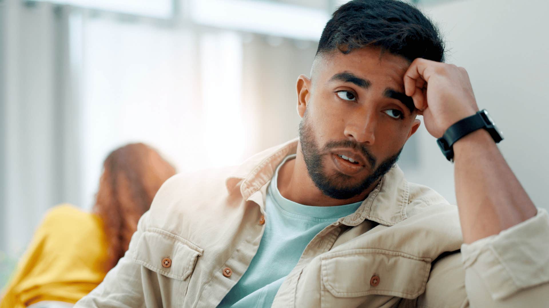 passive-aggressive and moody man turned away from partner