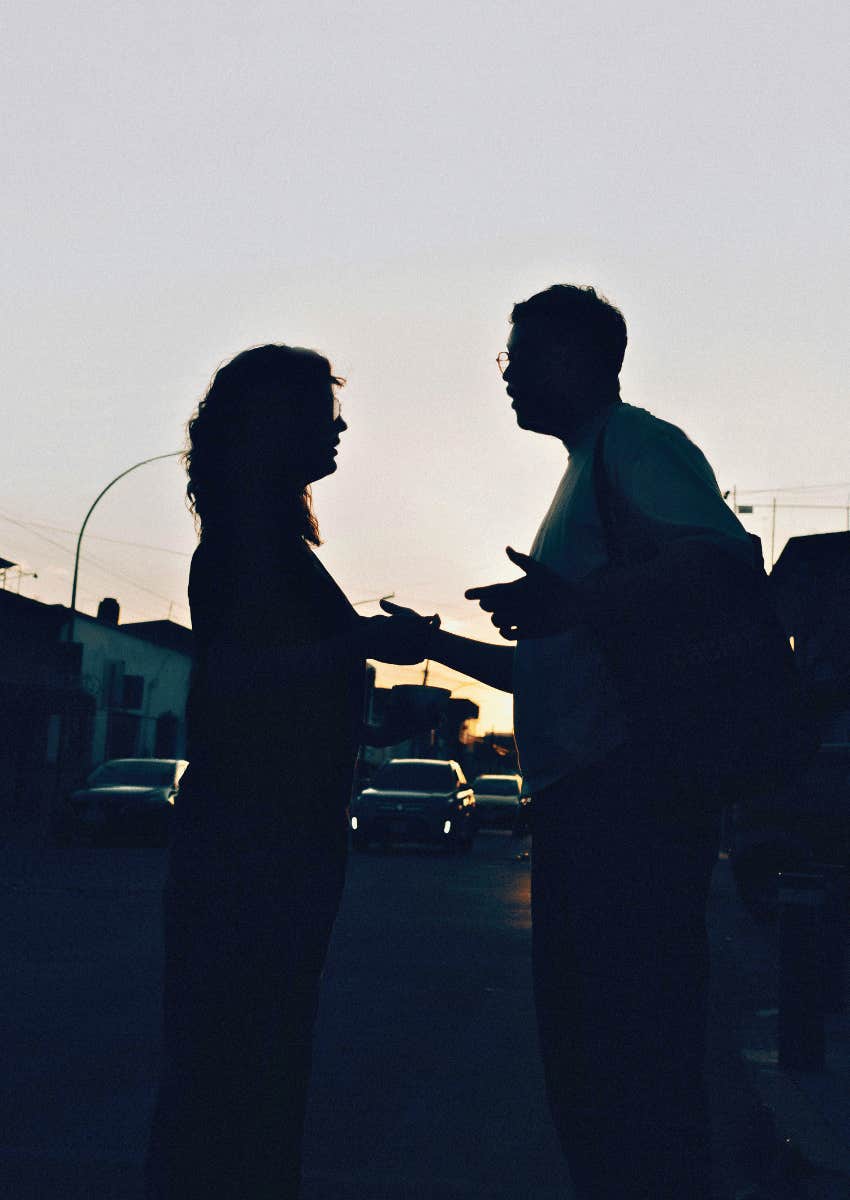silhouette of couple talking at sunset