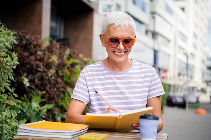 intuitive woman journaling to clear mental noise when life feels really uncertain