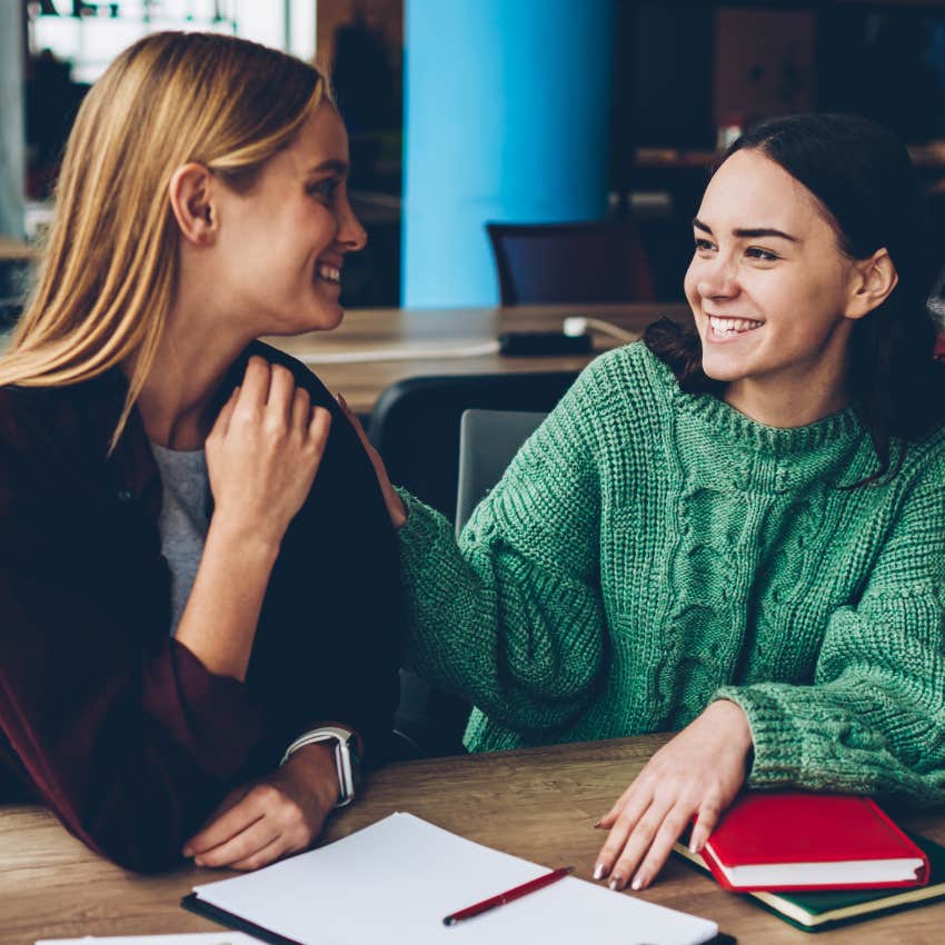 two women laughing at themselves in conversation