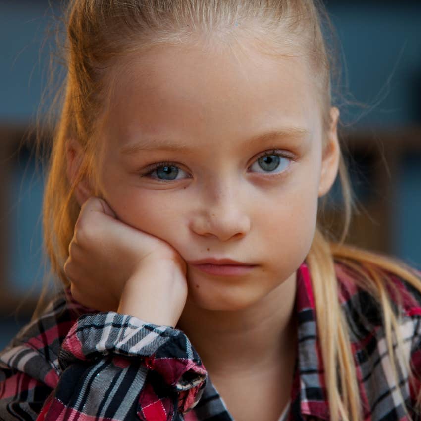 girl sitting at home bored after parents created no structure