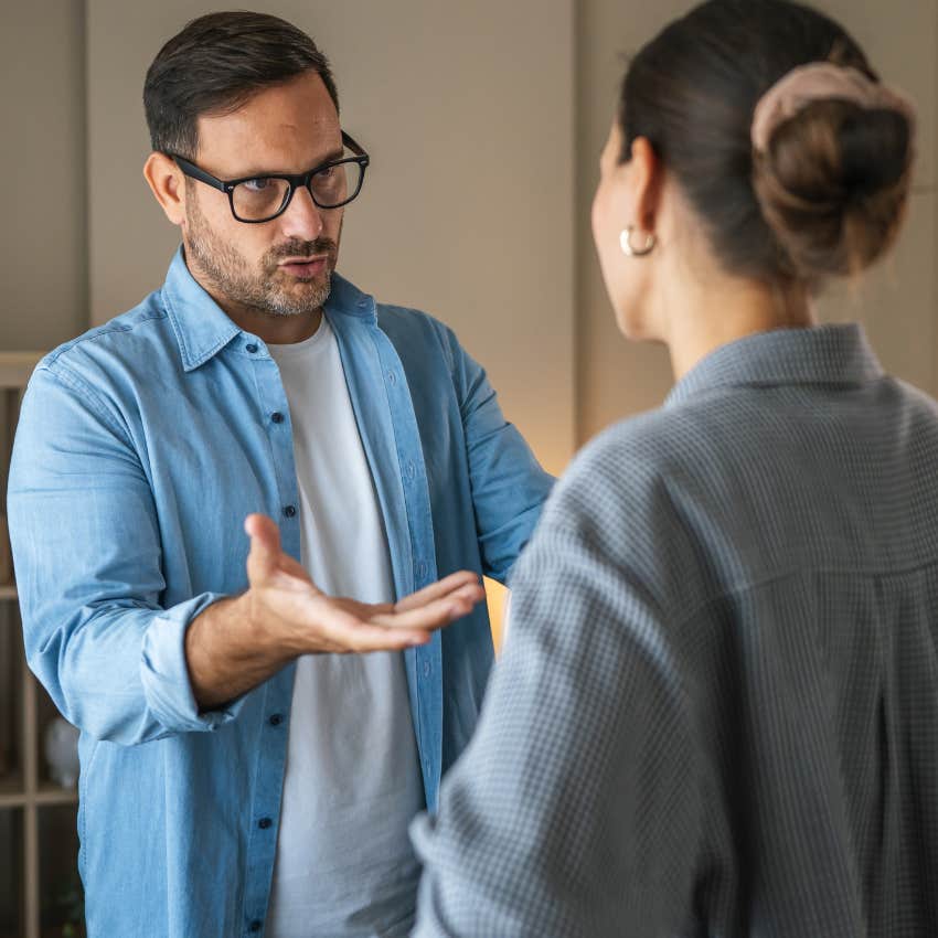 man laying his cards out on the table to win an argument with his wife