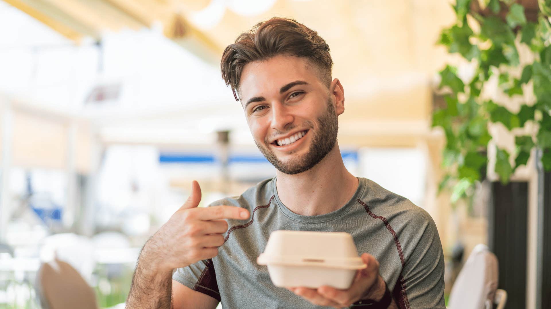 financially irresponsible man buying lunch at work