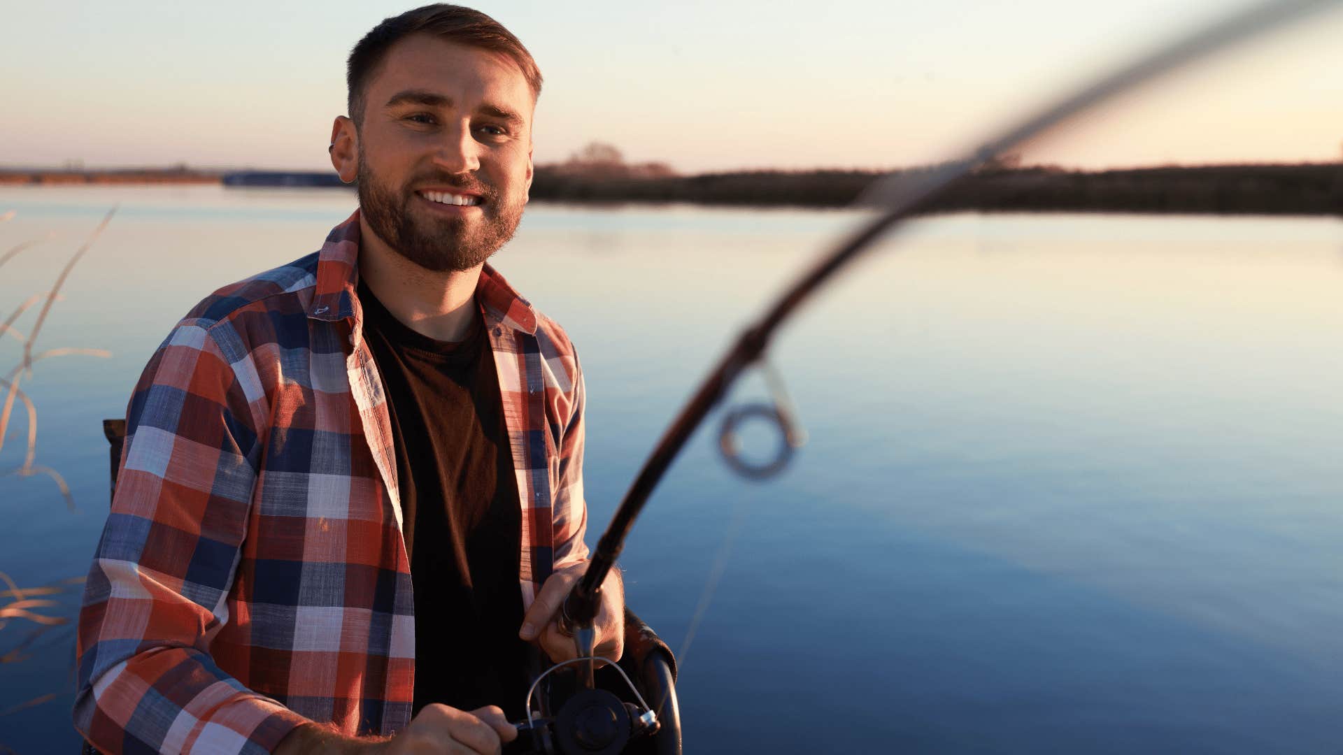 man with expensive new fishing pole out on the lake
