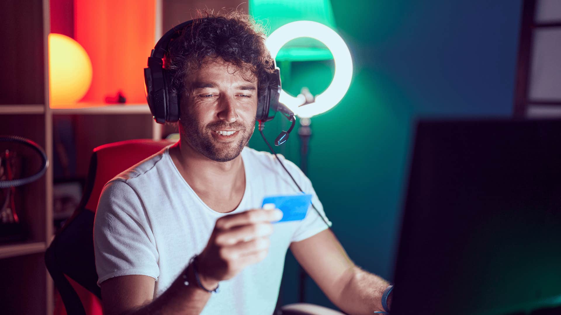 financially irresponsible man making purchases for his gaming set up