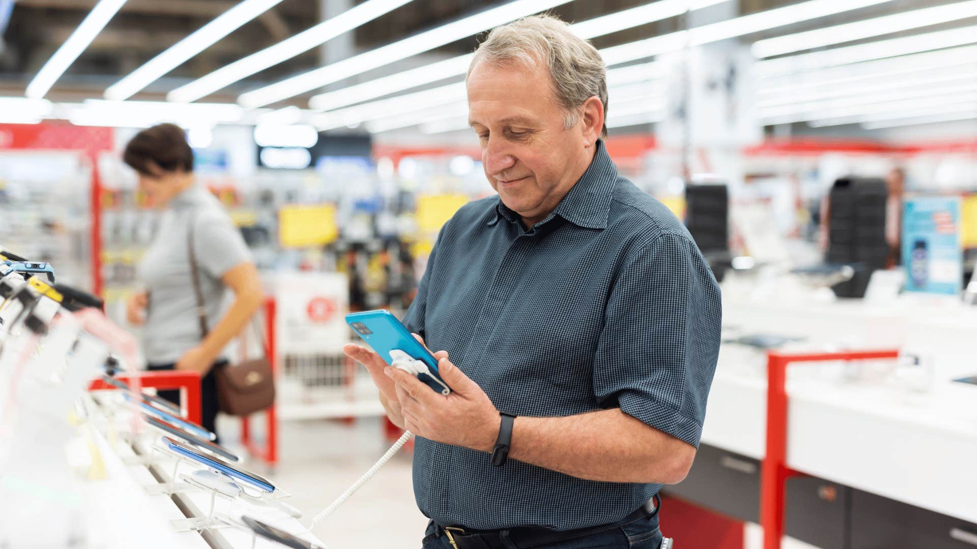 man making impulse tech purchases at the store
