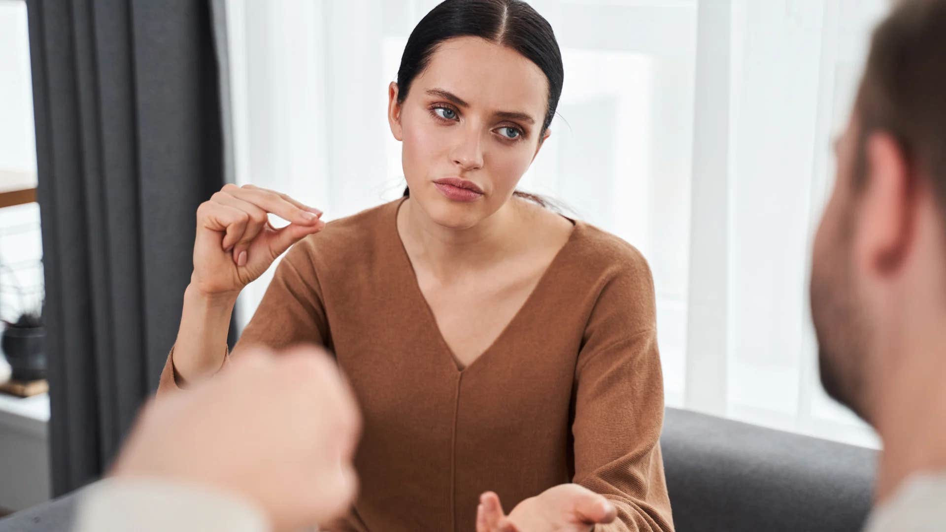 intelligent woman annoyed and offended at man saying that's how i was raised in disagreement