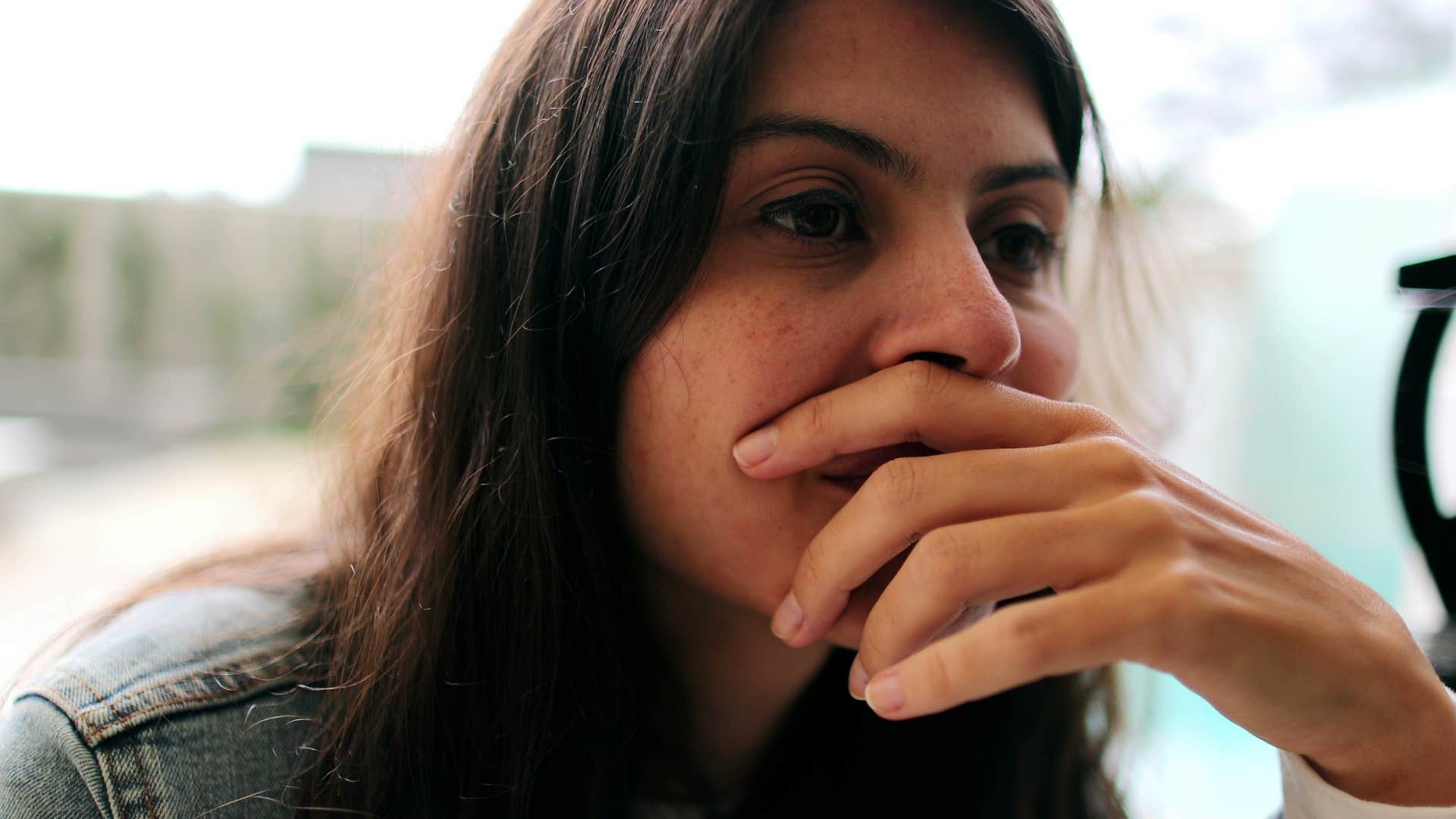 woman adopting overly analytical rigid thinking style looking sad