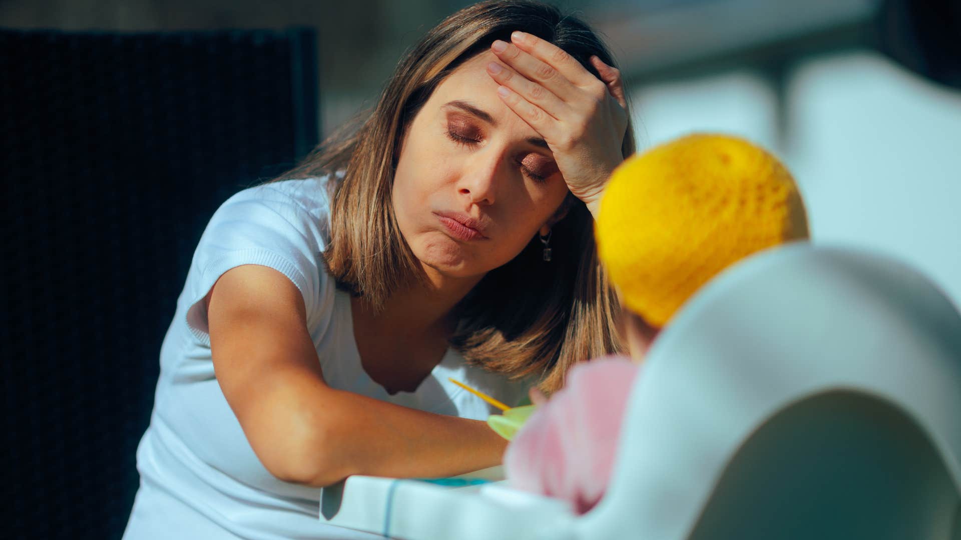 woman pressuring herself to start a family feeding baby