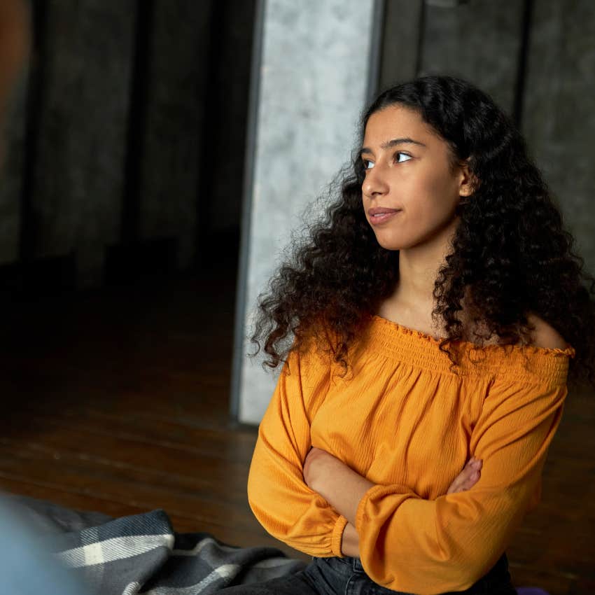 smart woman looking annoyed realizing someone is lying to her