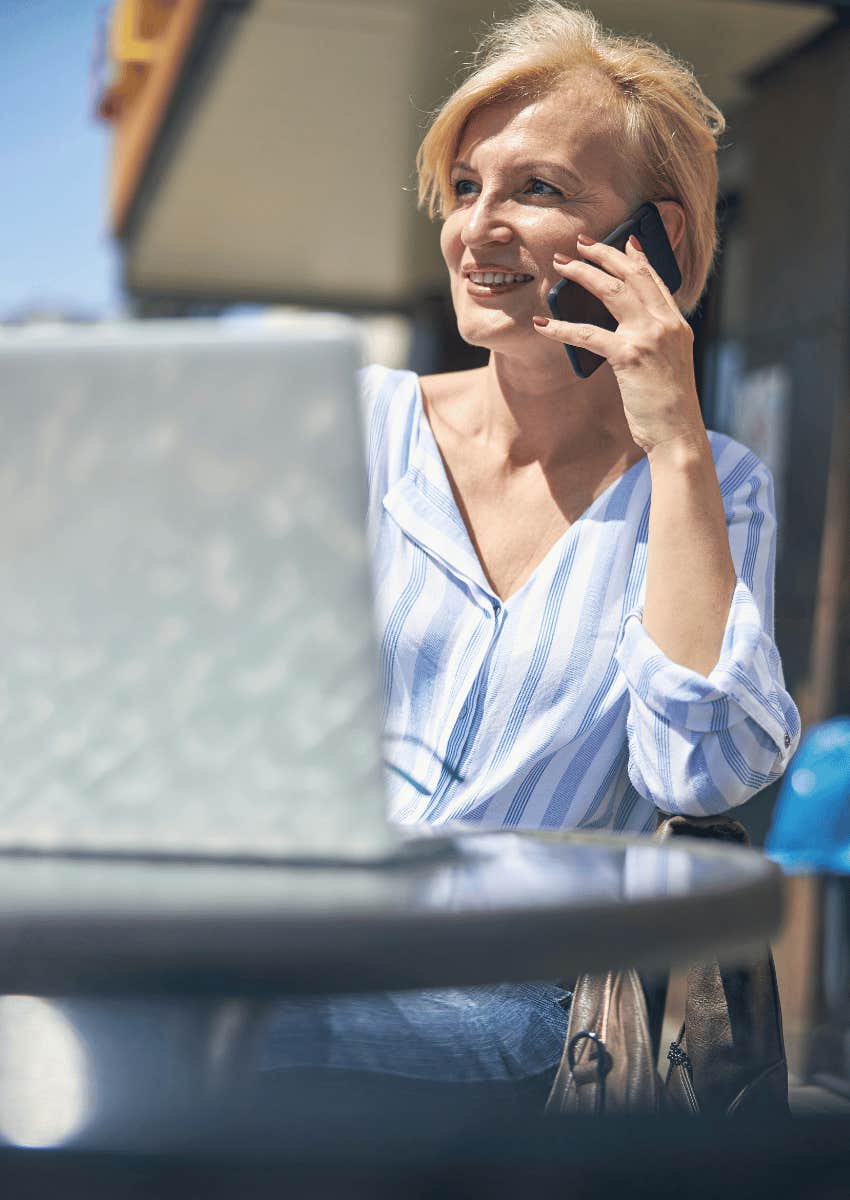 smiling mature woman talking on phone