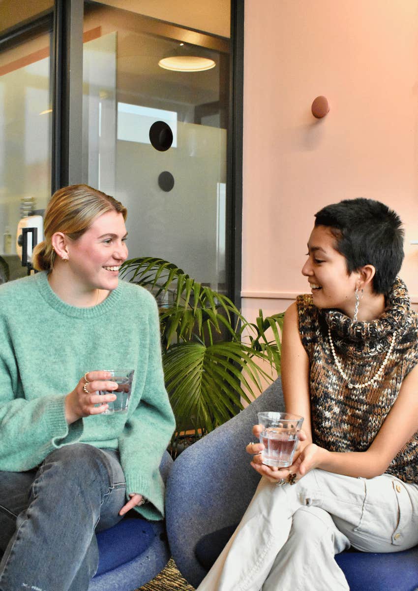 smiling open-minded women talking