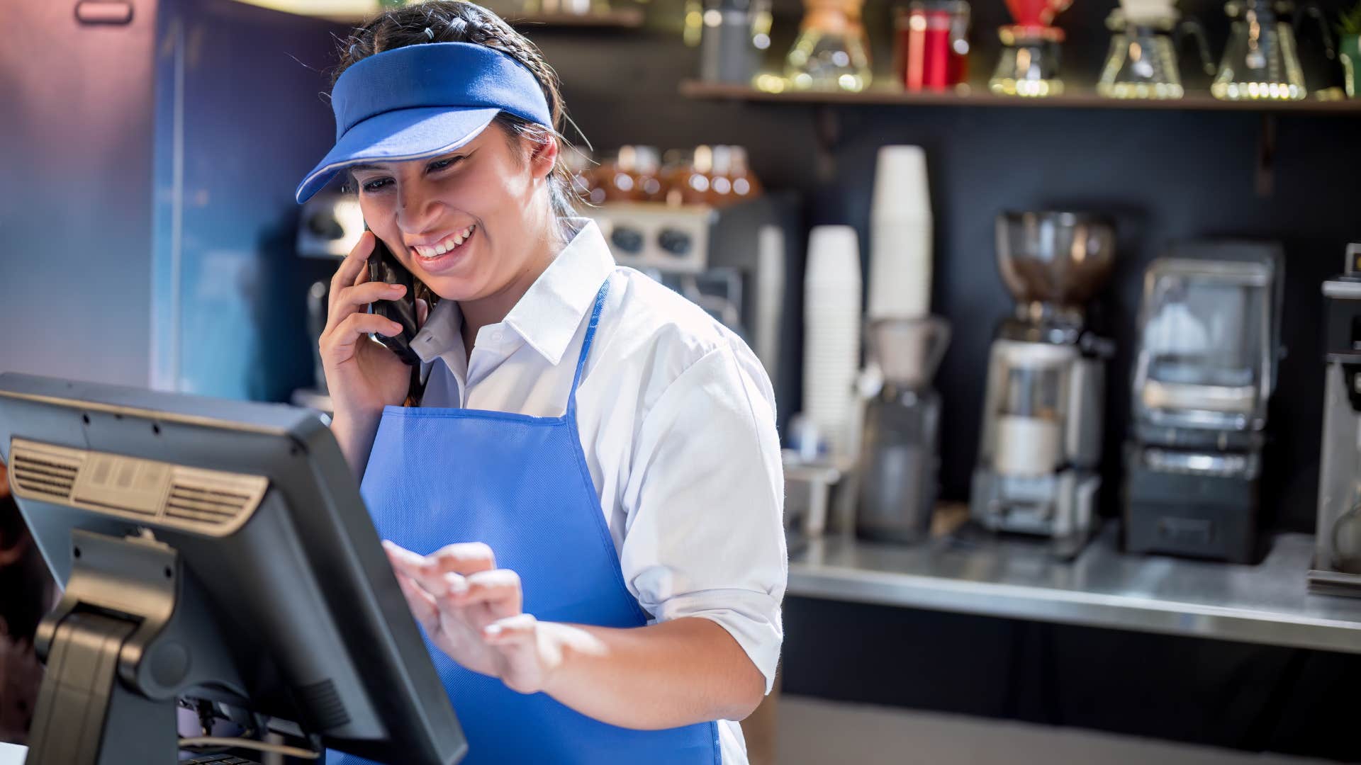 fast food worker on the phone with customer