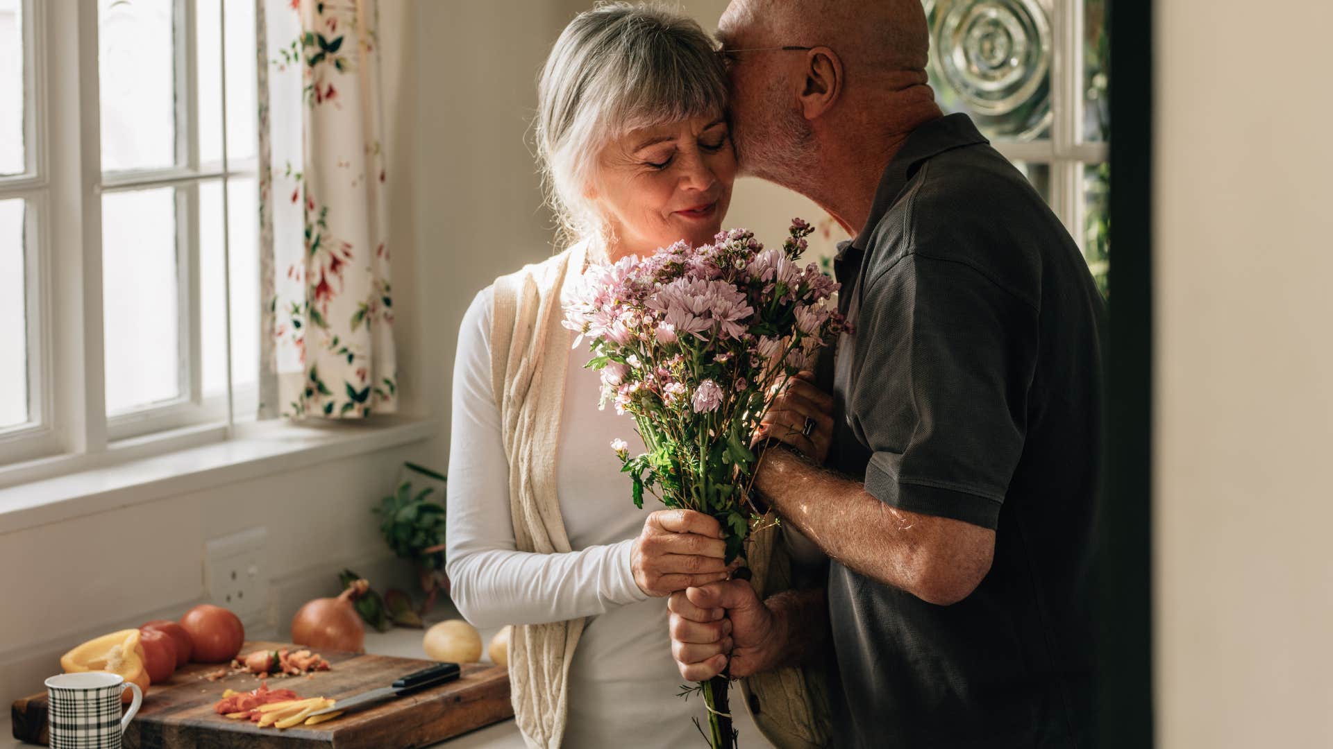 husband love bombing his wife giving her flowers