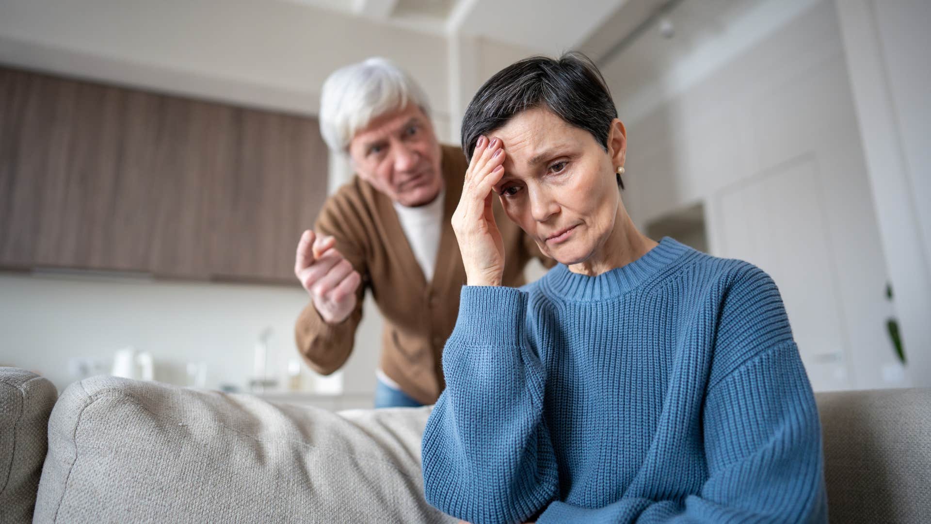 husband controlling his upset wife yelling at her