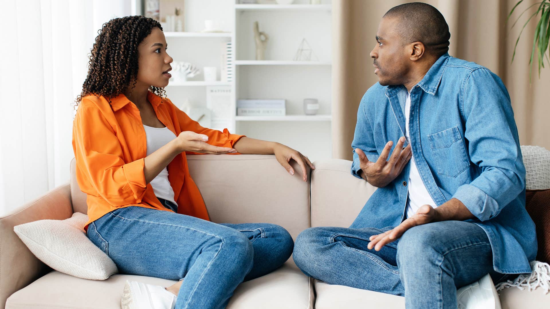 woman asking man if he's still stuck on something