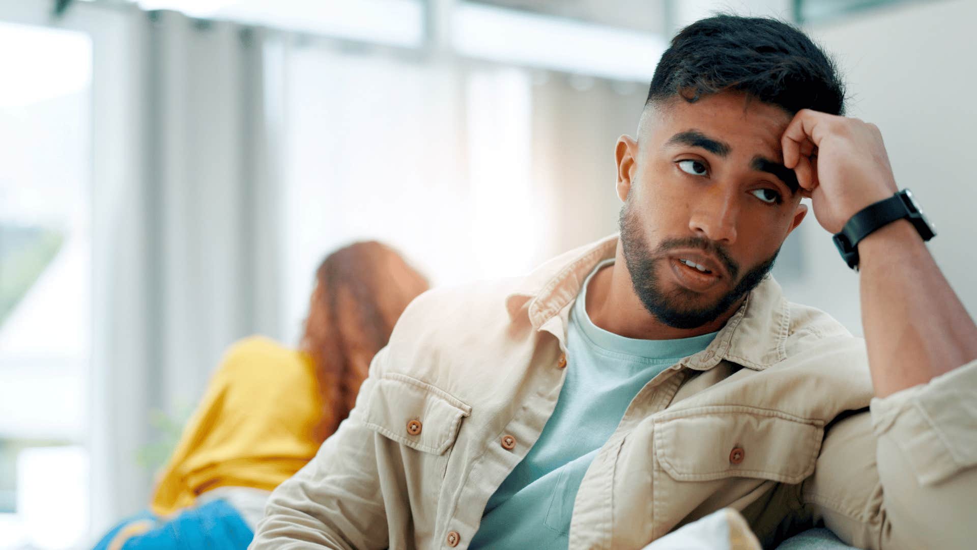 man isolating himself ignoring his partner at home