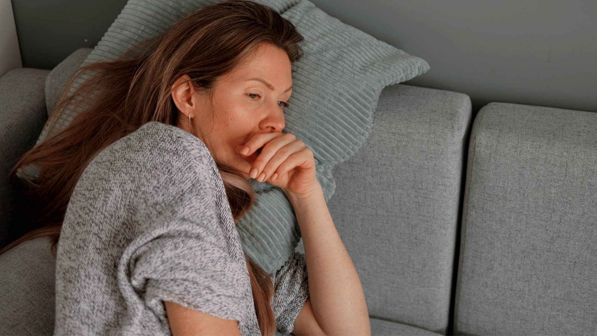 sad woman in bed lacking motivation to do anything