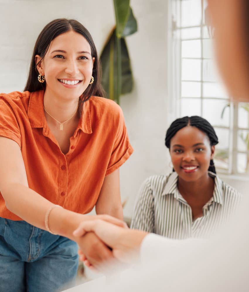 trustworthy person shakes hands showing kindness