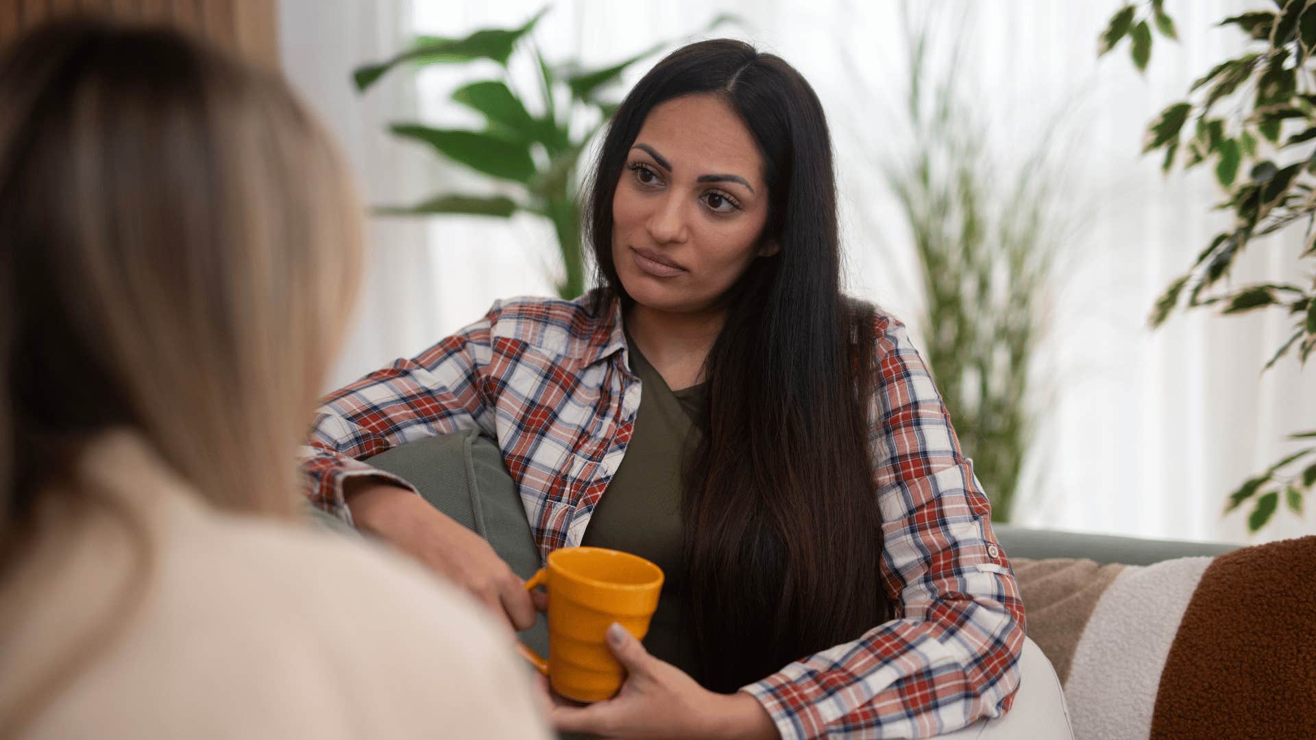 introverted woman annoyed at social interaction with friend