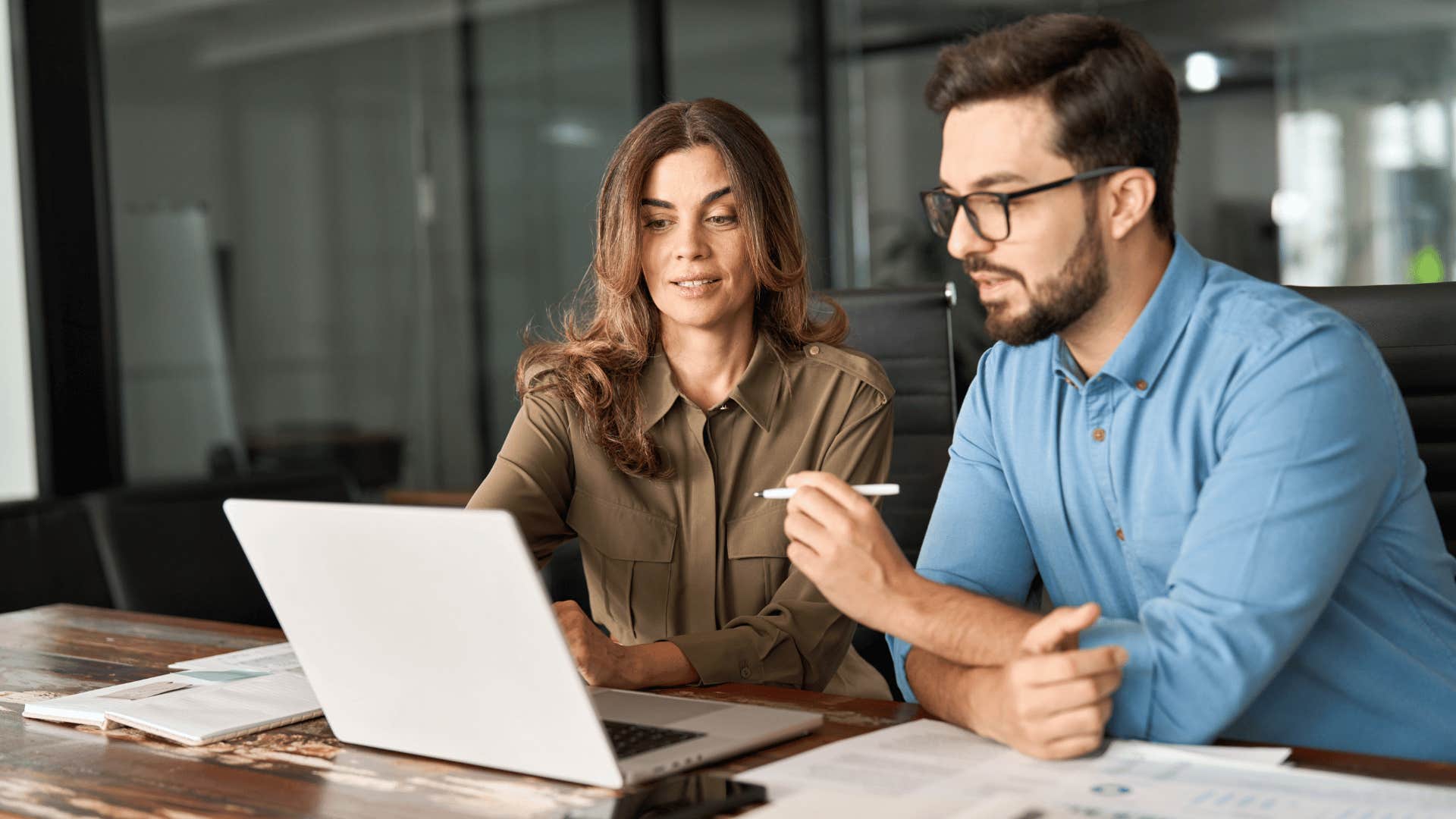 woman putting introverted man on the spot at work