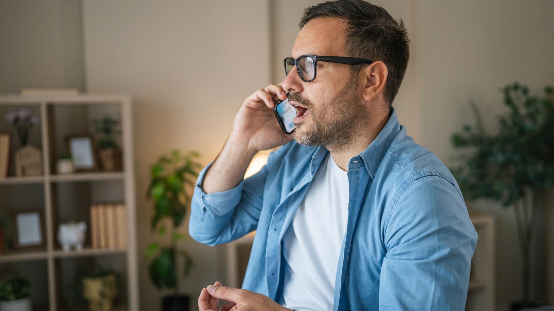 man on the phone saying I already tried that looking frustrated