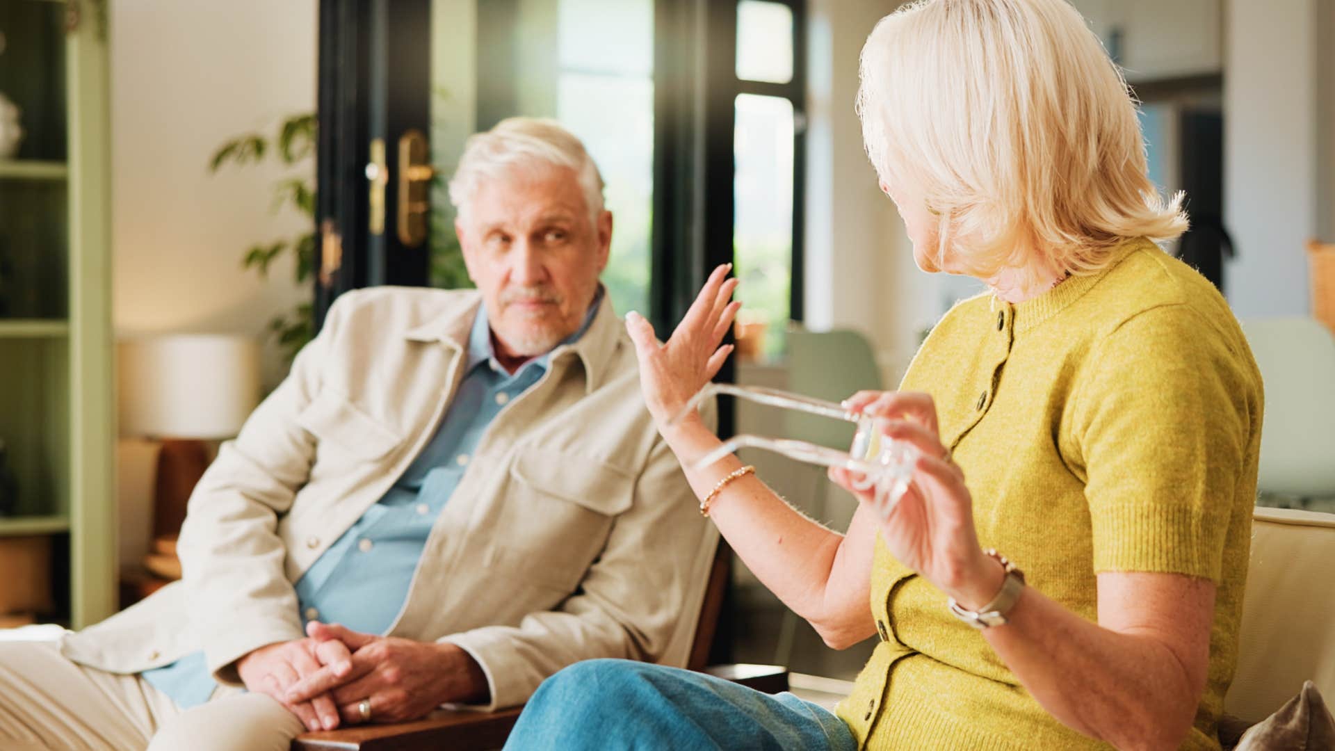 older woman saying just let me do it to her husband hurting his feelings