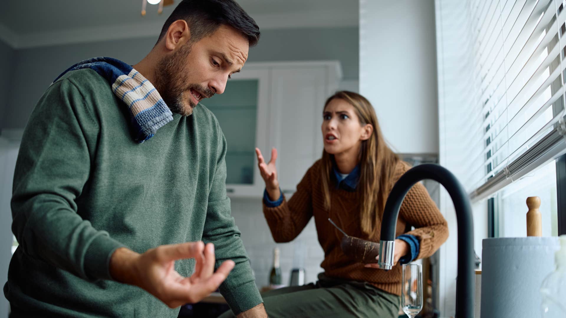 woman scolding upset husband saying you never do the chores