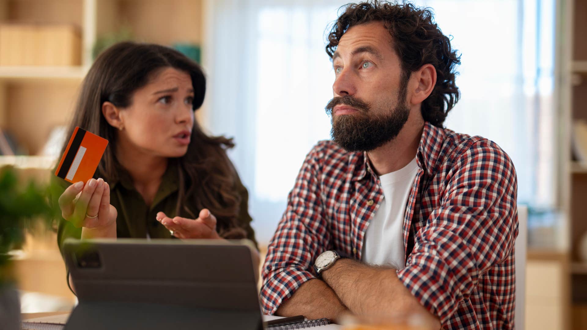 woman belittling her husband hurting him by saying you're not even a provider