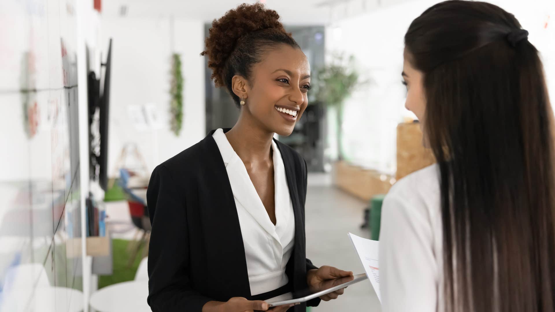 friendly woman greeting colleague by her name