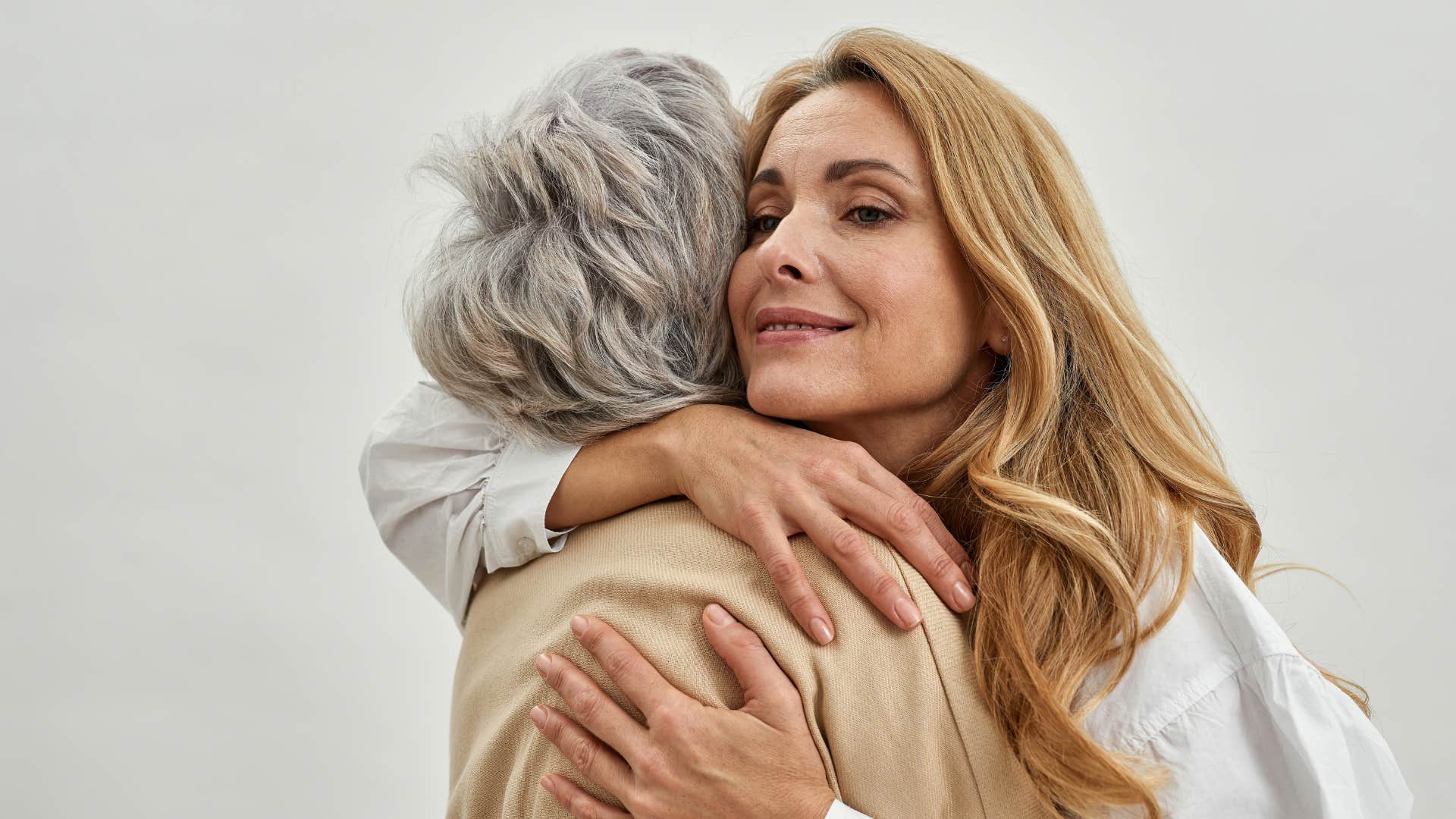 woman expressing gratitude often hugging her mom