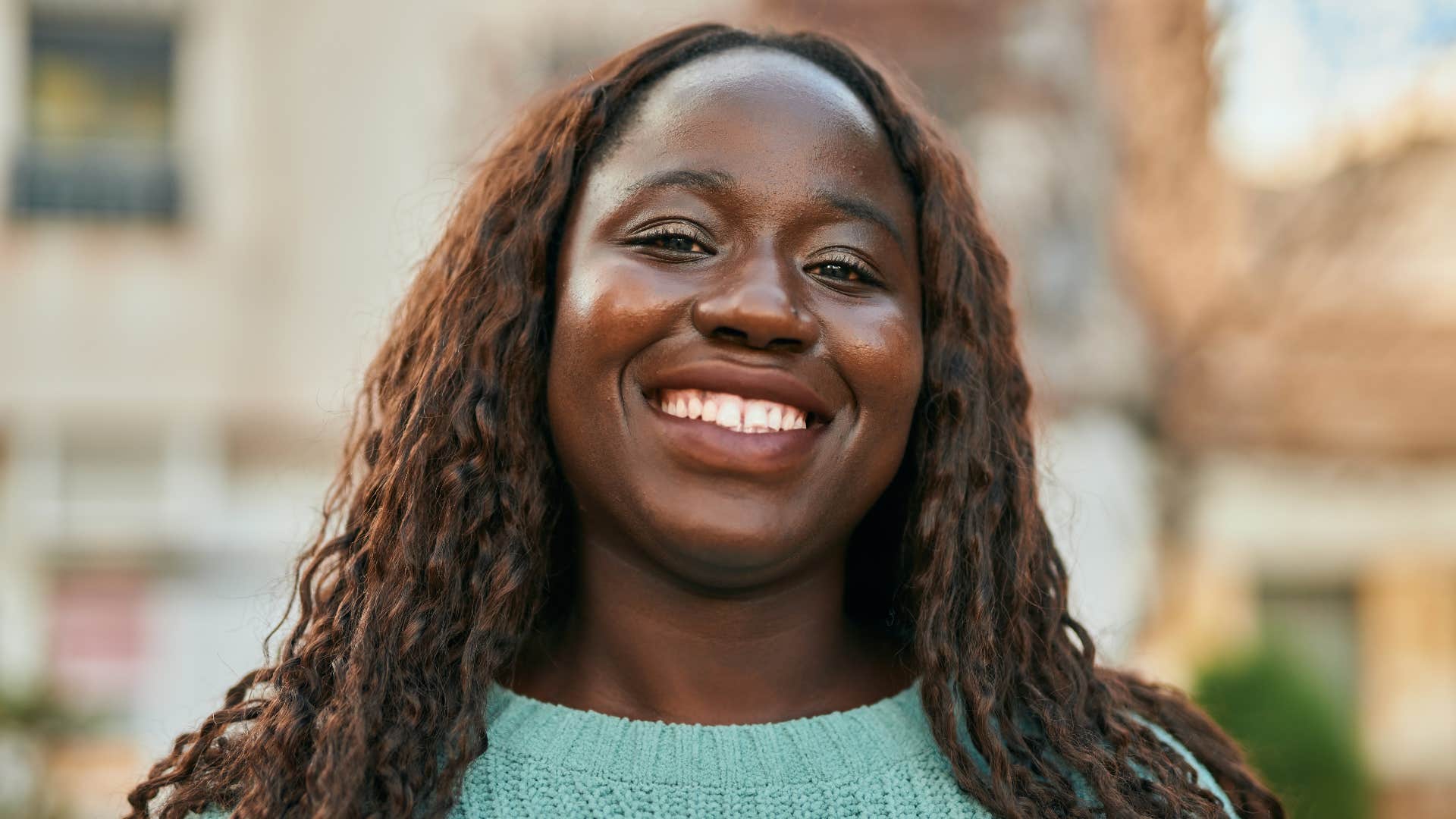 confident and magnetic woman smiling brightly
