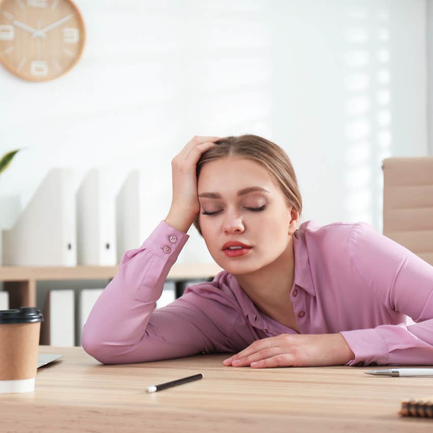woman sleeping at desk