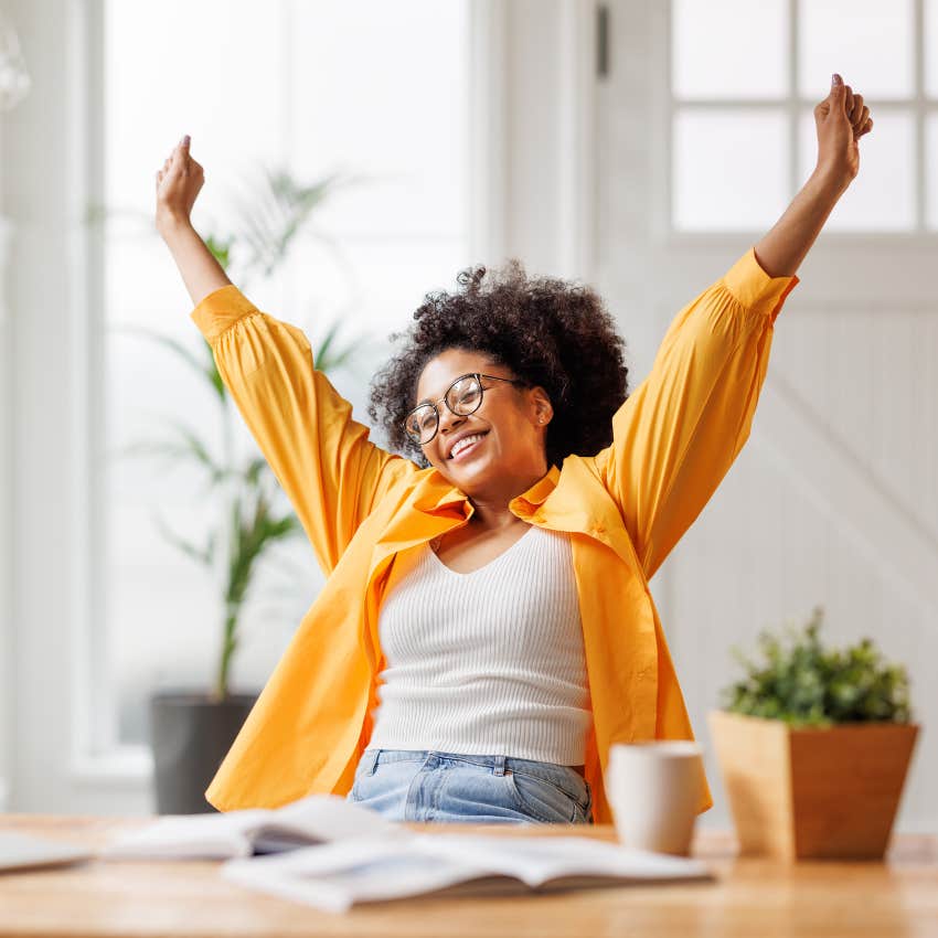woman celebrating because she is winning at the game of life
