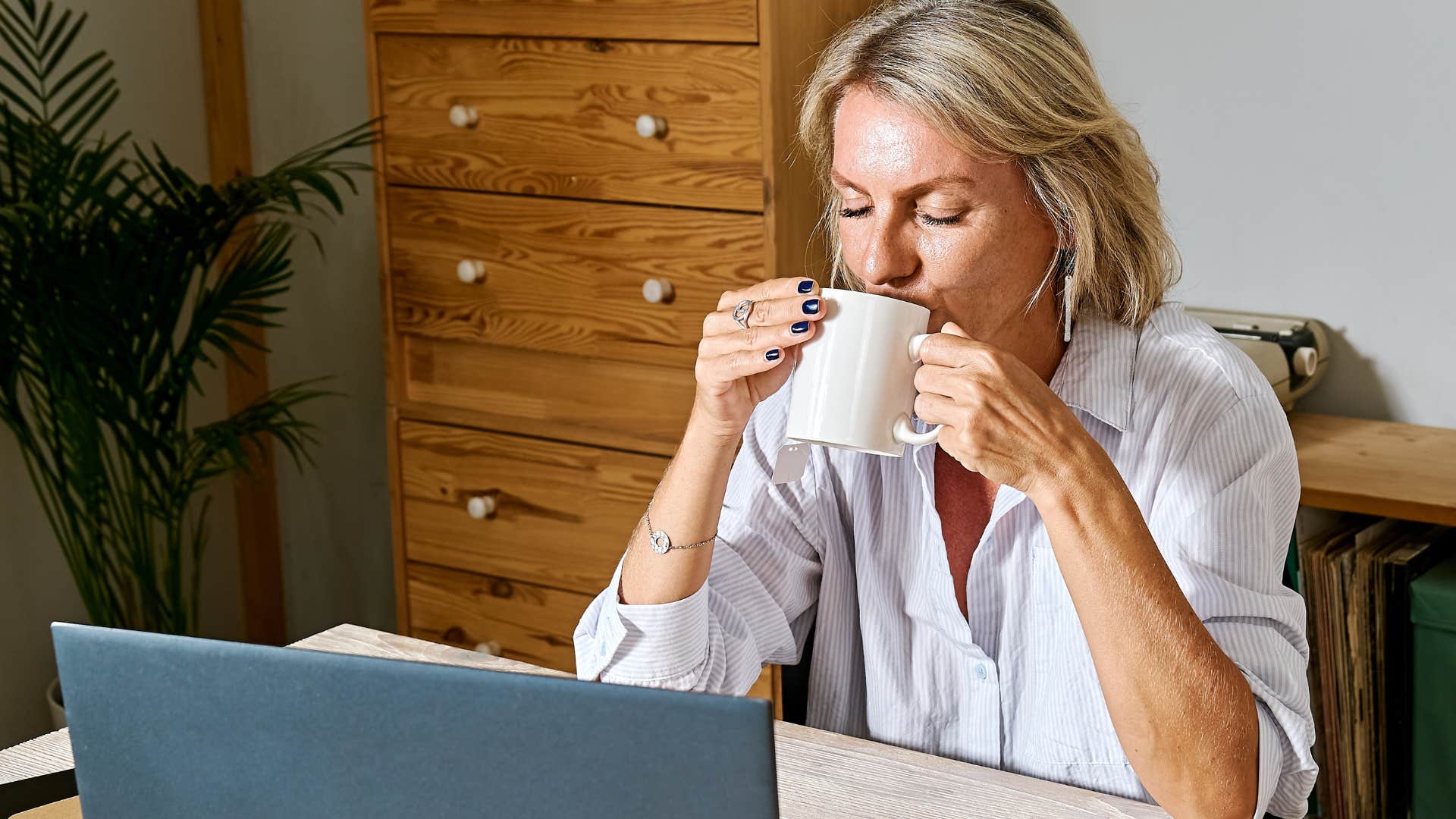 woman infusing food and beverages with intentions drinking coffee