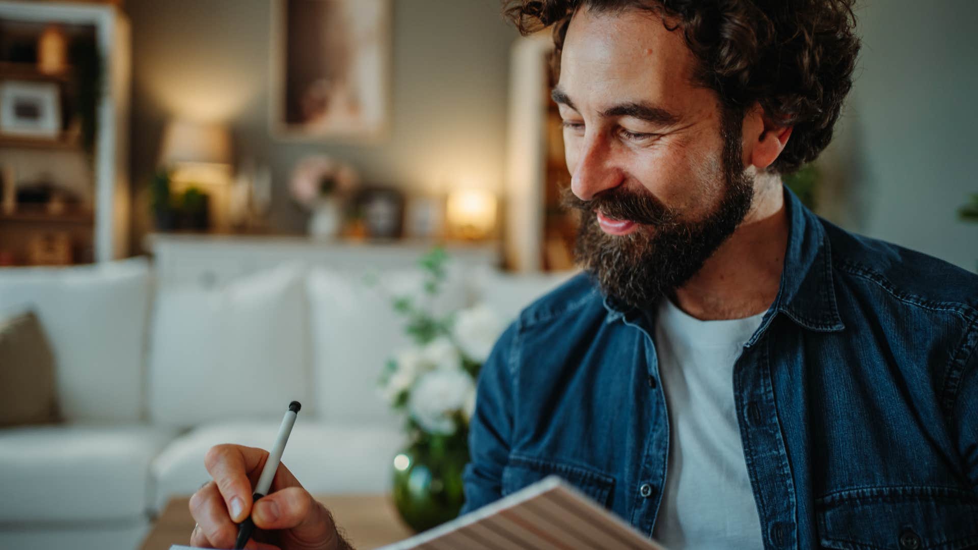 man writing a gratitude list to create the reality he wants