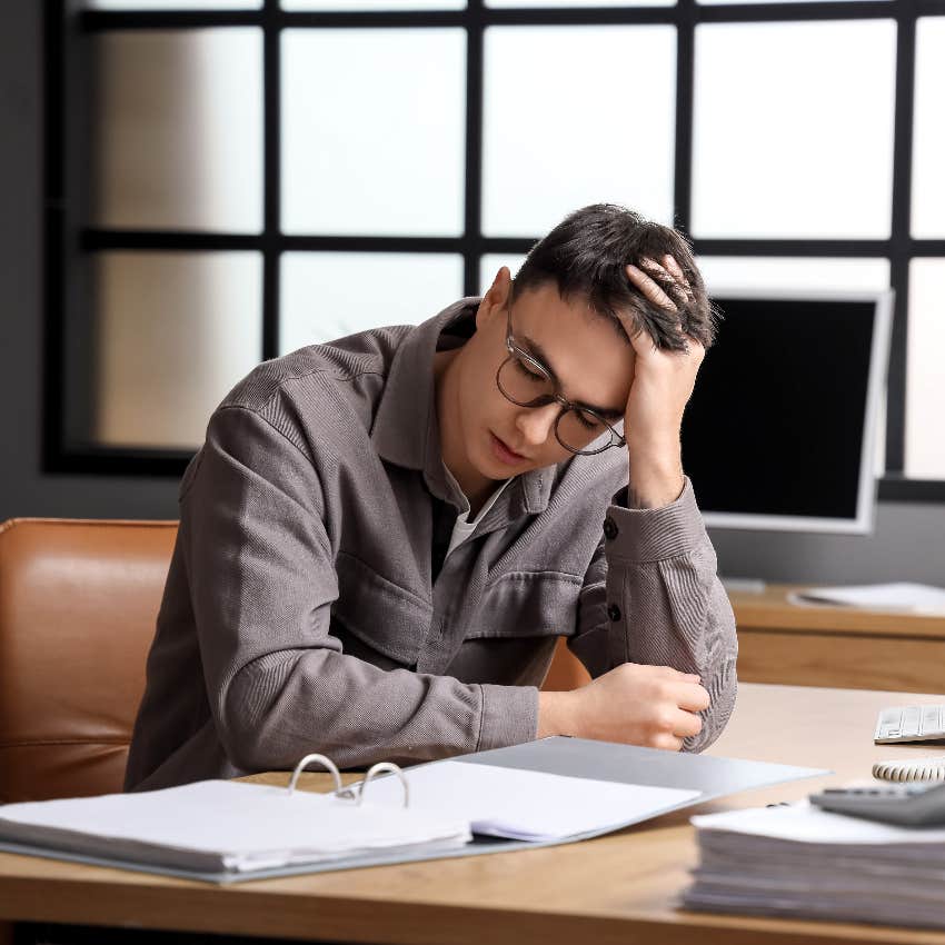 stressed male candidate sitting at desk worried about being ghosted