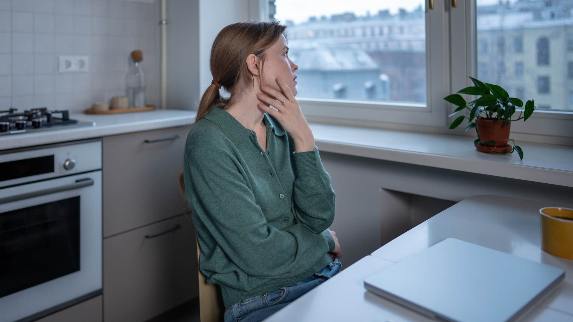 stressed woman in her kitchen saying i've been so forgetful lately