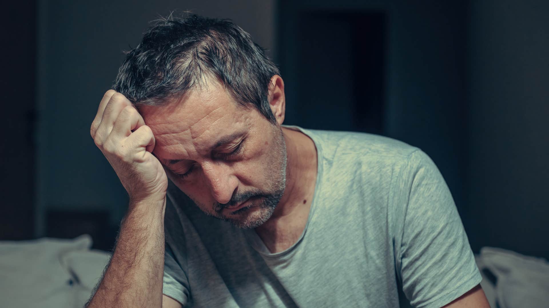 stressed man clutching his head unable to think straight
